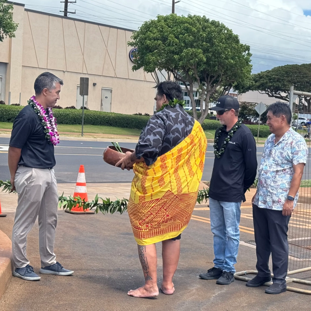 The Maui Telsa supercharger blessing ceremony as they are about to cut the line to open the stations to the public. Tom (Maui EVs), the kahuna, and other community members are present.