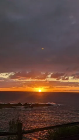 Sun setting into the ocean along the Kapalua Coastal Trail