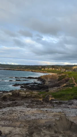 Looking back at houses and dirt trail part of the Kapalua Coastal Trail